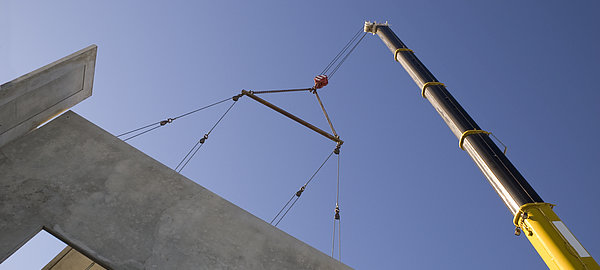 "Building Exterior, Building Activity, Built Structure, Chain, Concrete, Concrete Slab, Construction, Construction, Construction Site, Crane, Industrial Objects/Equipment, Industry, Industry, Lifting Equipment, Nobody, Objects/Equipment, Sky, Spreader Bar, Telescopic Crane", Wall